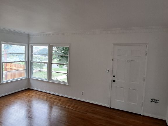 Living room with faux fire place heater, New hardwood floors oak, will have window ac unit with wifi access. Size is 12'x18' sq feet. 

Here is walk through video of the unit: