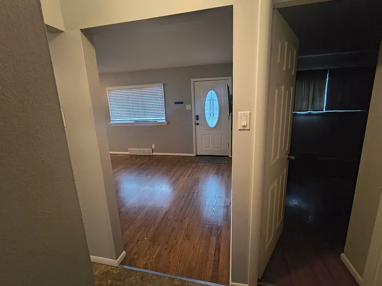 From bathroom facing the front door and main bedroom