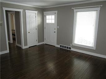 LIVING ROOM W/ REFINISHED HARDWOOD FLOORS