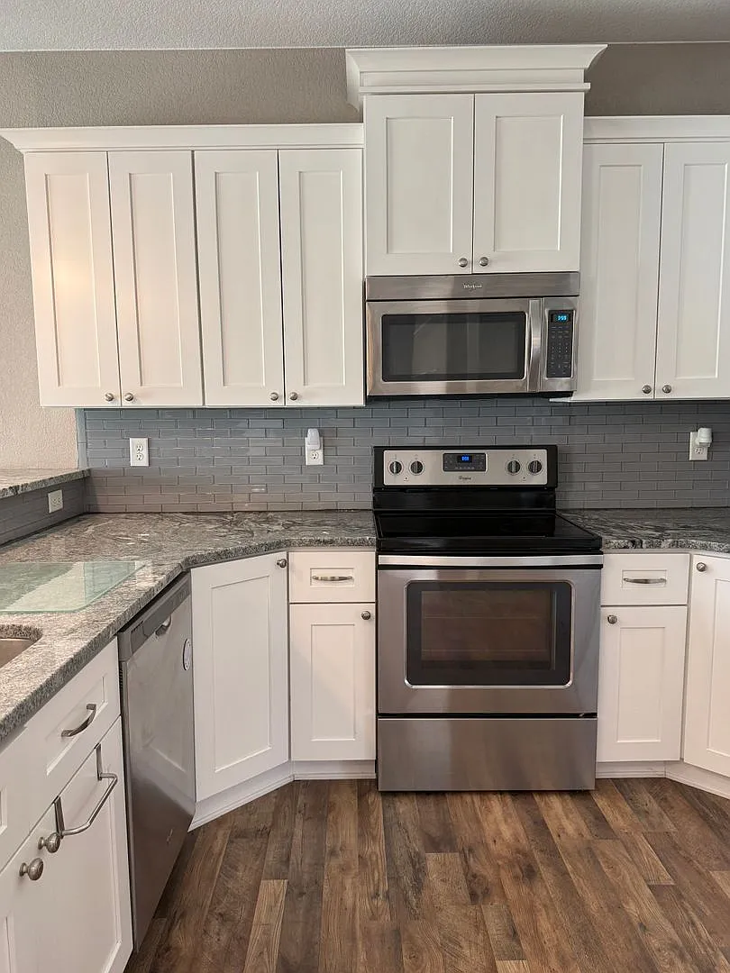 Spacious 4-Bedroom Twin Home | 3-Stall Garage + Fenced Yard — Photo 4