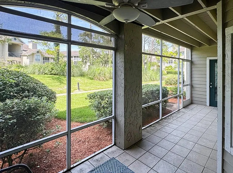 Screened patio on the shaded side of the building away from the parking lot.