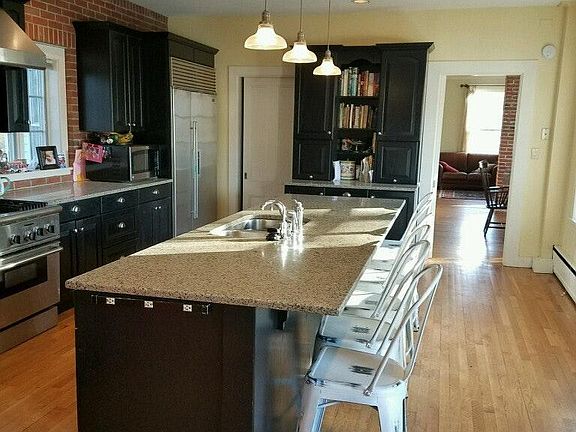 Gourmet kitchen with Subzero fridge, brick oven pizza oven a