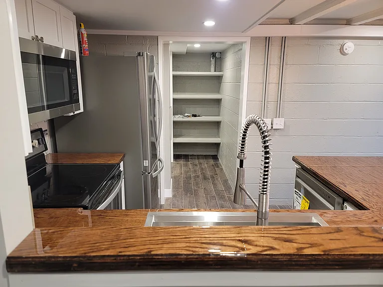 Kitchen view from South side. Can lights over working area