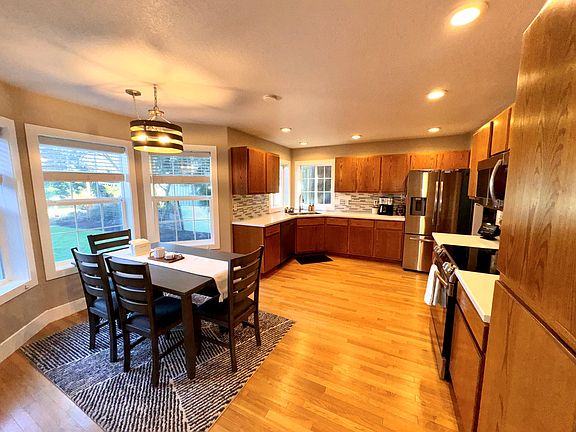 Beautiful kitchen/dining room with windows looking to front yard