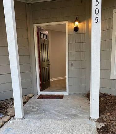 Entry is covered with shaker cedar siding, private walk-way, and inviting entry.
