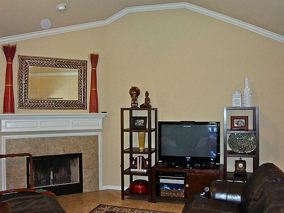 Wood burning fireplace with gas connections.