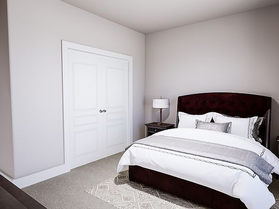 A cozy and well-furnished bedroom with a plush bed, dark wooden furniture, and a neutral color schem