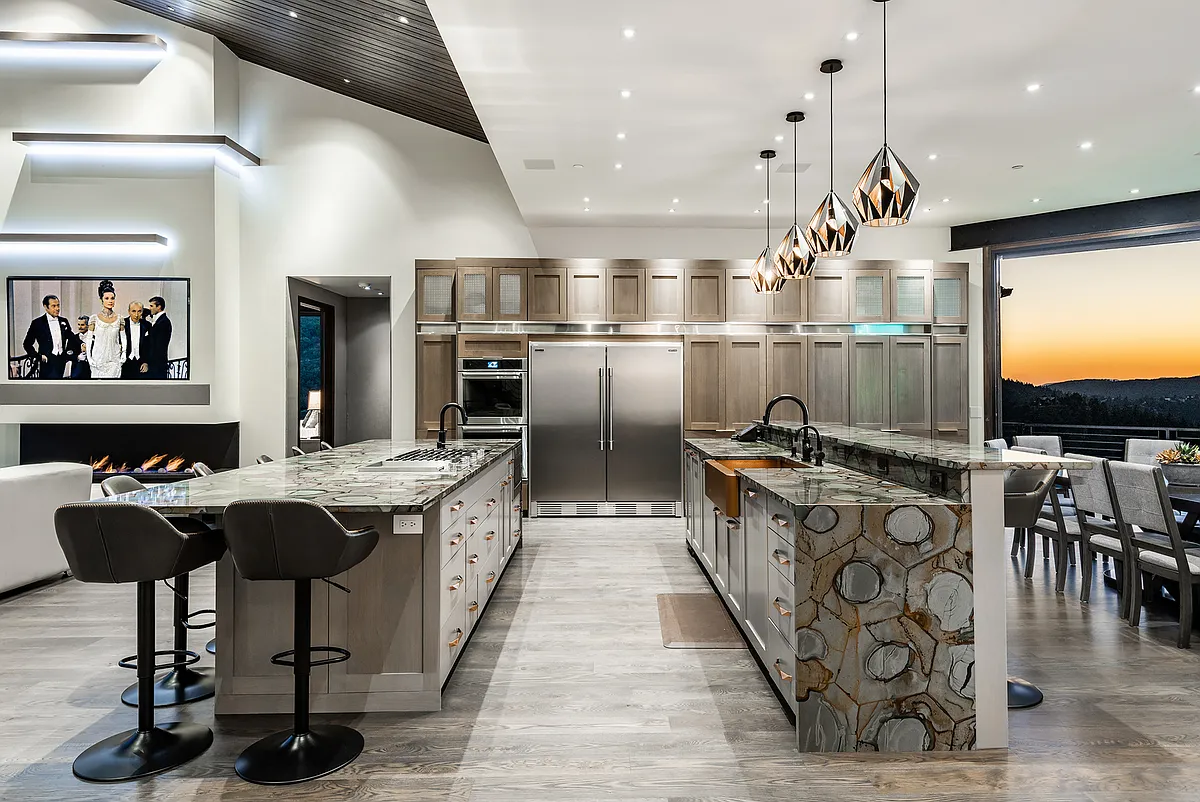 Double islands, one with cook top, one with sink and TWO dishwashers. Full size built in fridge and freezer and ample cabinetry - 7325 Pine Ridge Dr