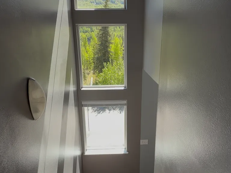 Staircase to the upstairs bedrooms and loft