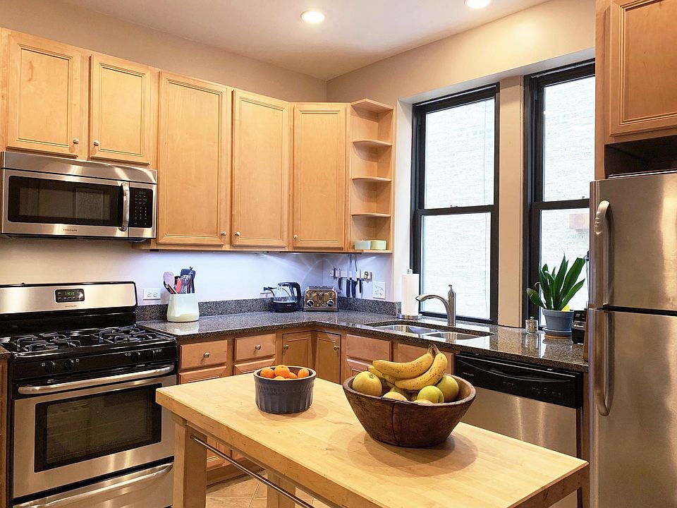 Granite countertops with birch wood cabinets