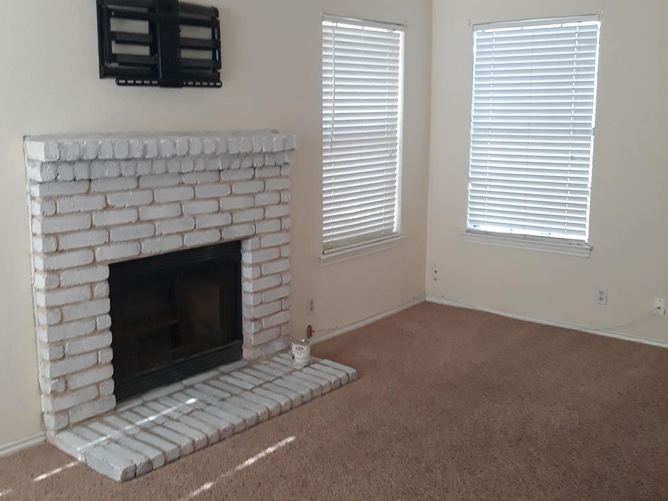 Carpet has been replaced with wooden floors in living room.