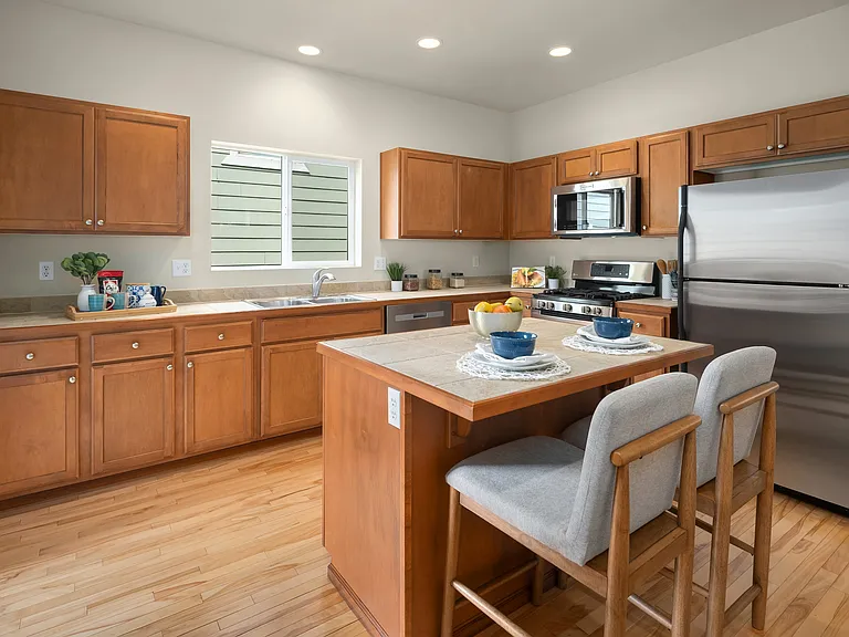 Kitchen with center island and stainless steel appliances