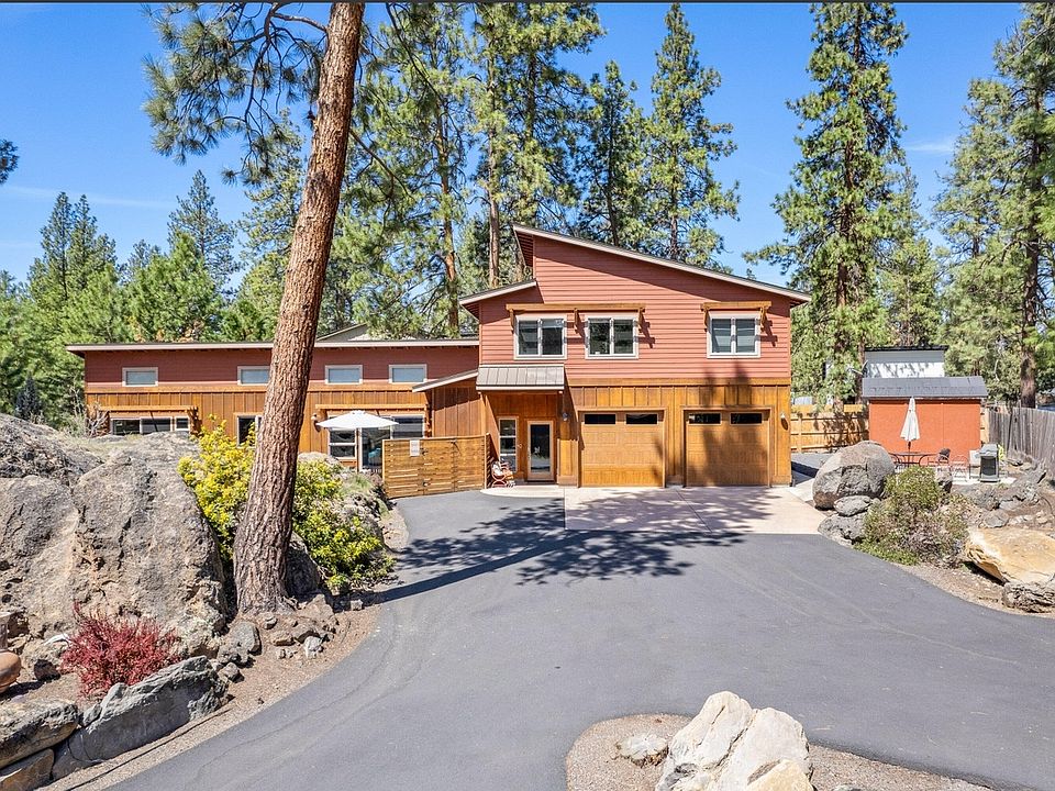 The ground-floor unit is separate from the upstairs two-bedroom unit situated over the garage (both accessed through the front door, with separate private entry doors inside). Ground-floor renters have full use of the two-car garage.