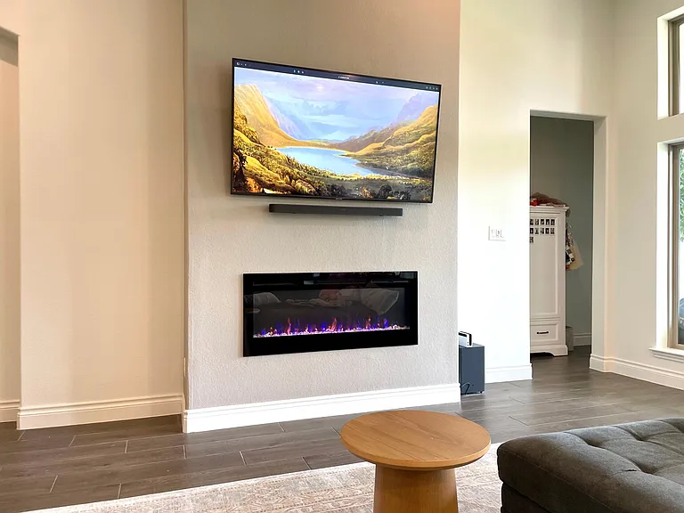Updated living room with added faux electric fire place (built-in heater)