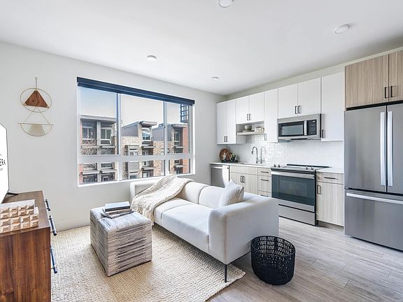Unlock your outdoor oasis at Modera Golden Triangle. Certain Modera homes feature private balconies and patios just steps from your kitchen, offering a perfect blend of indoor-outdoor living in Denver.