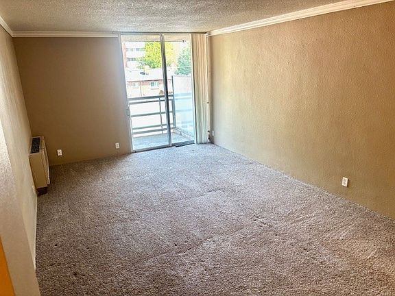 View from the kitchen towards the living space and balcony.