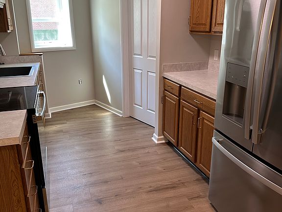 Large kitchen with lots of counterspace and cabinet storage.