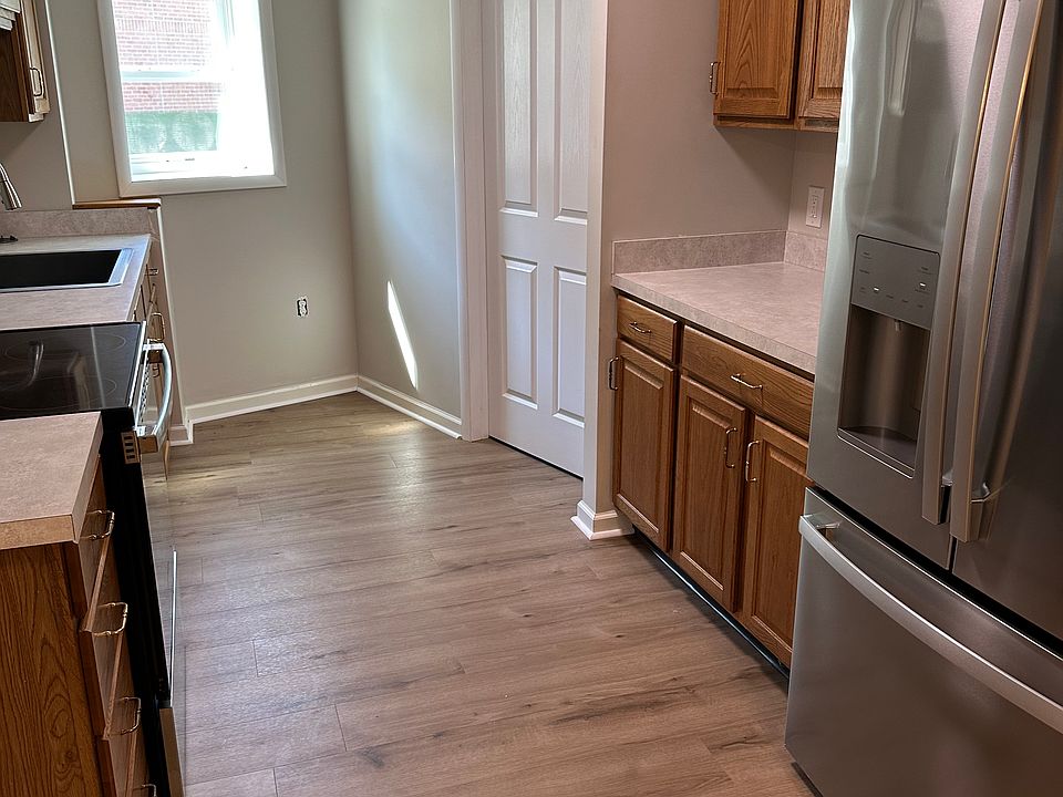 Large kitchen with lots of counterspace and cabinet storage.