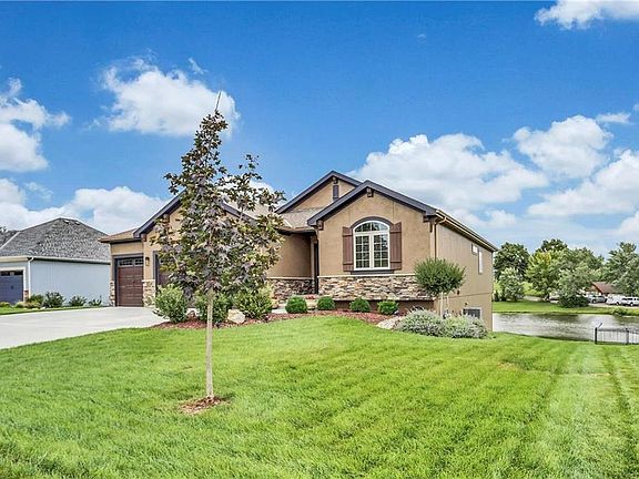 Gorgeous and wide lot with upgraded landscaping and landscape lighting  + pancake flat driveway