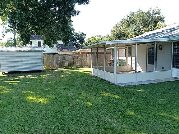 backyard screened patio/storage bldng.