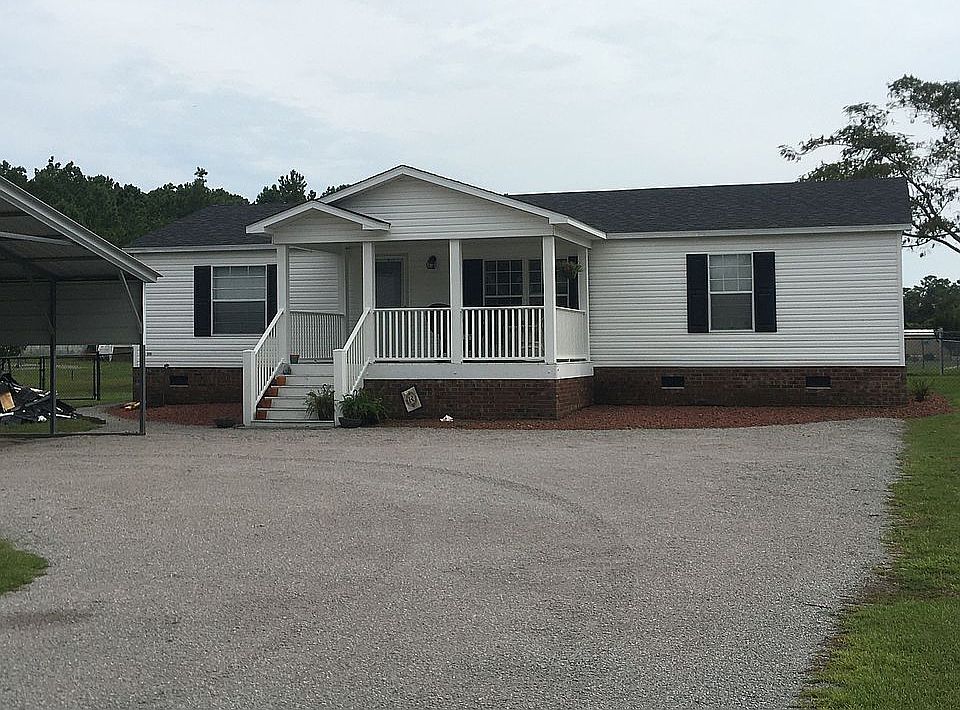 Front of home with carport  
