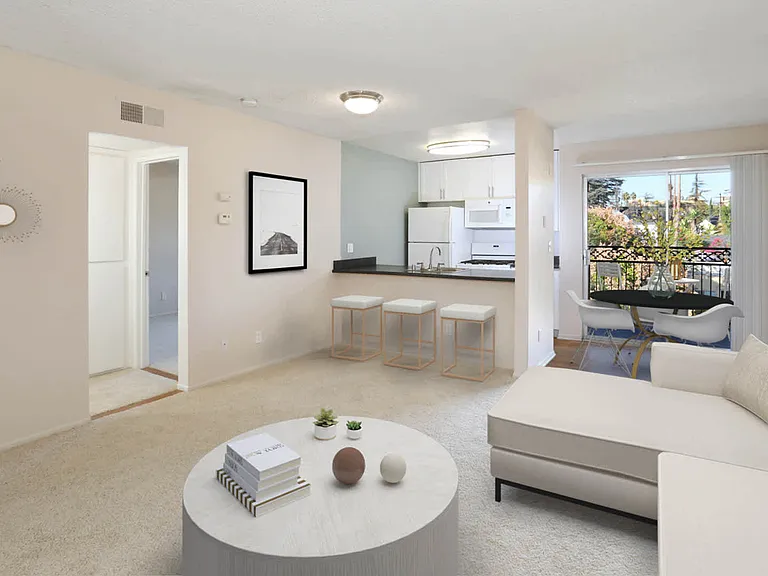 Carpeted Living Area and Balcony