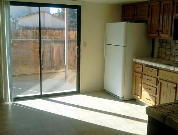 Refridgerator, Sliding Glass Door to Patio and fenced back y
