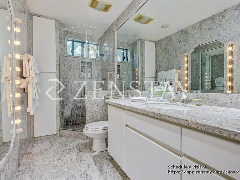 Well-appointed bathroom with elegant walk-in shower stall