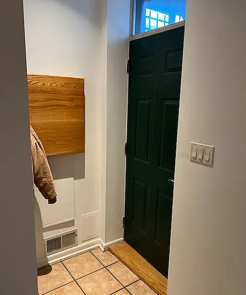 Front Door with coat closet (not shown)