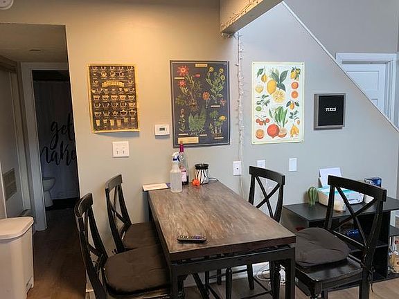 Unit 4 remodeled kitchen featuring upgraded cabinets, stainless steel appliances, and tiled backsplash