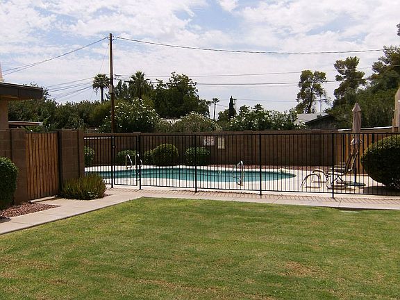 Sparkling pool/grassy common area