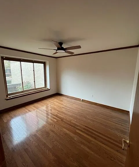 front bedroom with remote ceiling fan 10 x 16