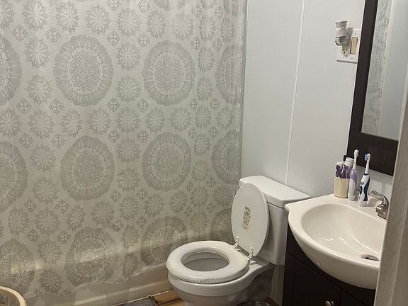 Bathroom recently updated with new floor, toilet and vanity