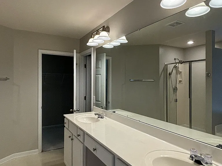 View of the vanity mirror and sinks.