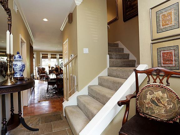 Beautiful slate entry flowing with natural light. Access to kitchen and powder bath.