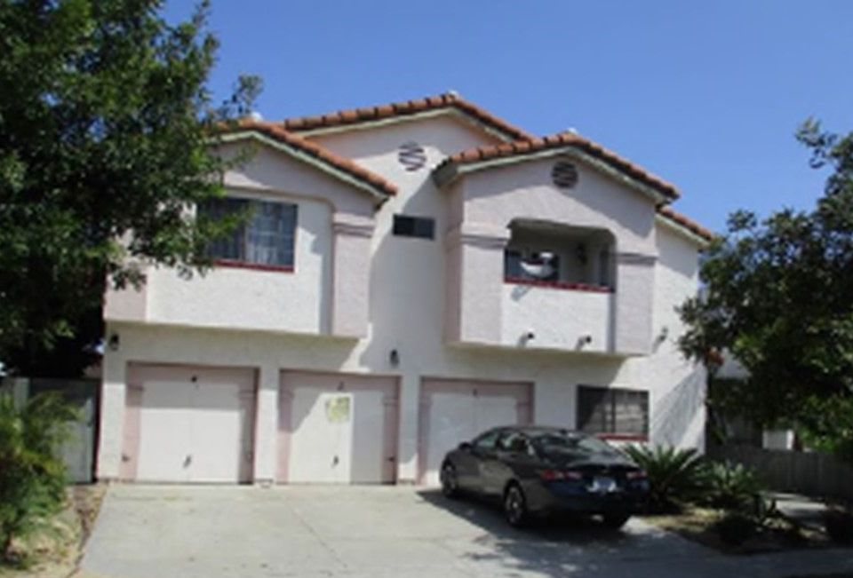 Street view of complex. Unit garage is Center Space. Main gate entrance to right.