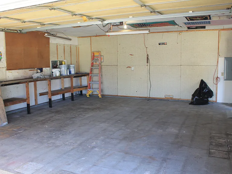 Two-space garage with a motorized door