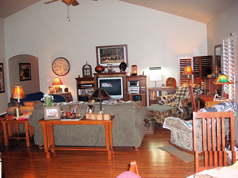 Living room.  Notice the ceiling fans and lovely floors.