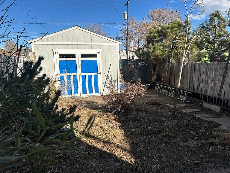 Backyard with storage barn.
