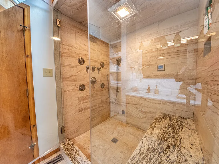 New steam shower with granite tiles.