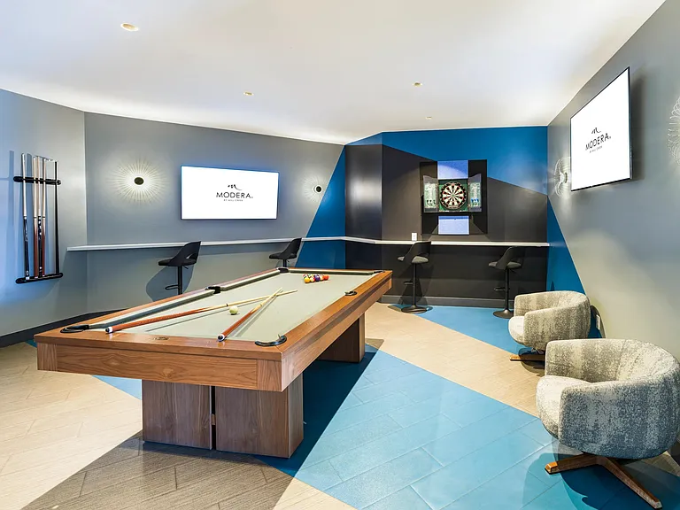 Game lounge with billiards, darts, and lounge seating_your go-to space for casual hangs and spirited competition.