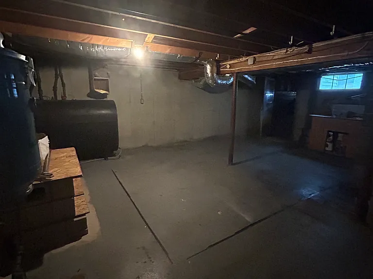 Unfinished side of basement- washer dryer hook ups, utility sink, new furnace
