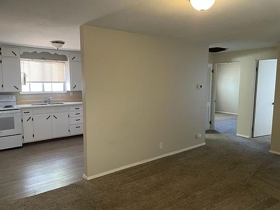 View of kitchen and bedrooms from living room