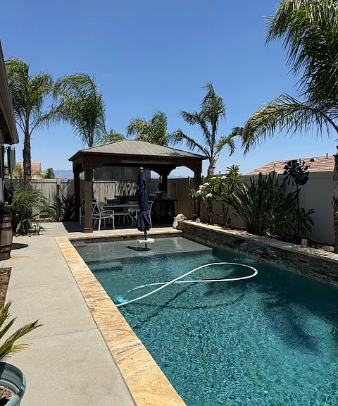 Backyard paradise showing pool and outdoor kitchen