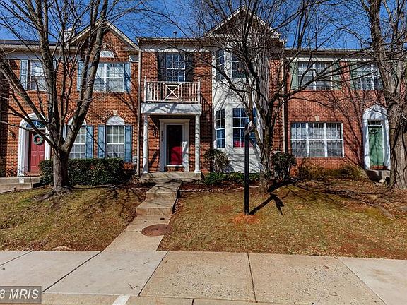 Beautiful brick front with portico and bay windows