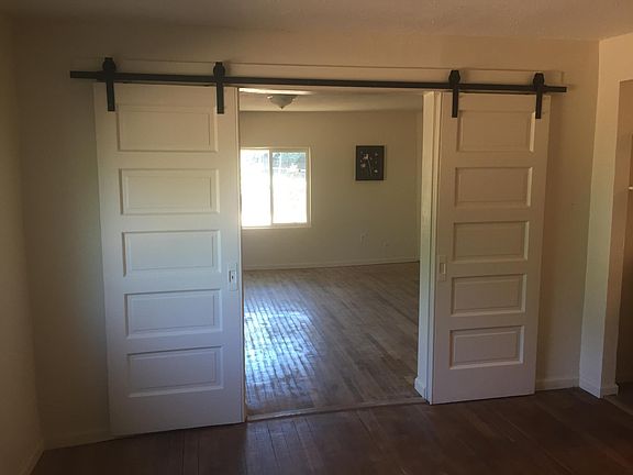 Living Rm or 3rd bdrm with operable privacy doors and hardwood floors.