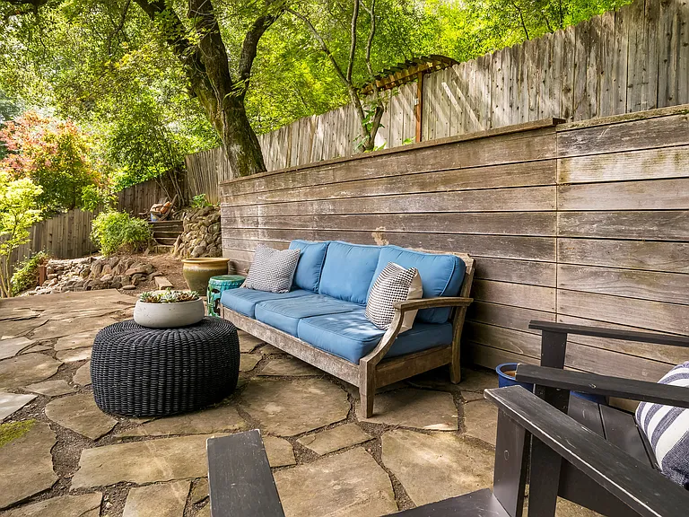 View of the sitting area at the top of the backyard garden.