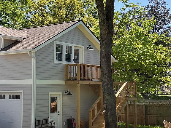 Full view of back yard and stairs/deck