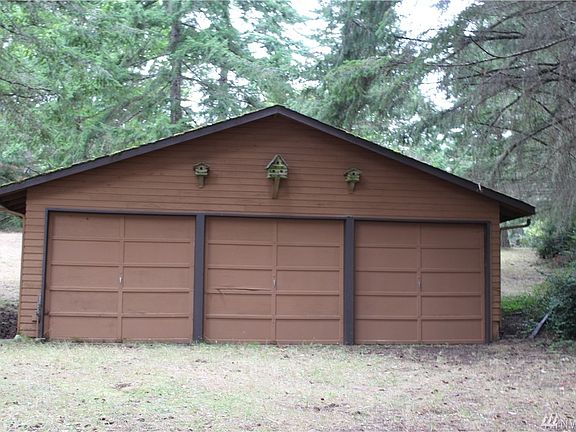 Very Large 3 car garage with plenty of room at the back with shop benches.  
