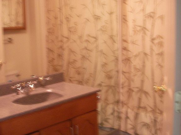 Bathroom has linen cabinet